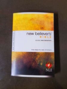 Photo of the New Believer's Bible - Pocket New Testament that's available to new believers at the Harvest City Church reception window